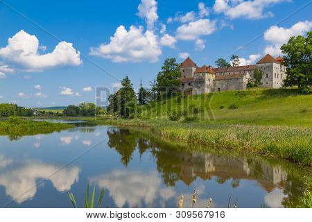 Beautiful Landscape With Ancient Svirzh ( Svirz ) Castle On The Hill Against The Blue Sky And White 