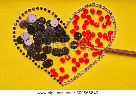 Embroidery Products And Tools. Heart, Rhinestone, Sequin And Red Roundels On A Yellow Background.