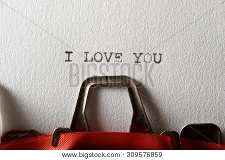 The sentence, Y Love You, written with a typewriter.