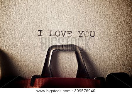 The sentence, Y Love You, written with a typewriter.