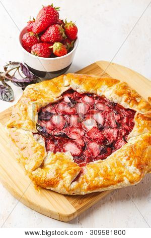Homemade Strawberry Open Pie Gallet With Purple Basil And Balsamic Dressing On A Light Background.