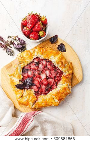 Homemade Strawberry Open Pie Gallet With Purple Basil And Balsamic Dressing On A Light Background. T