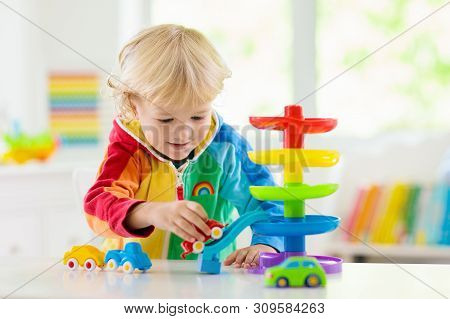 Boy Playing Toy Cars. Kid With Toys. Child And Car