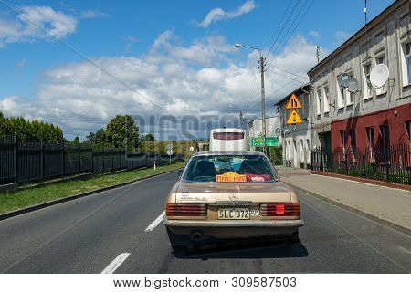 Wiecbork, Kujawsko Pomorskie / Poland - July 3, 2019: Rally Beijing - Paris. Rally Car In Street Tra