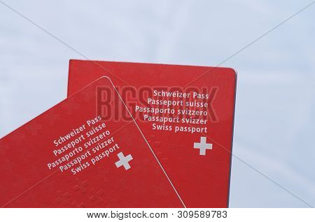 Front View Of Two Swiss Passport With White Background