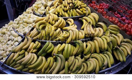 Bananas On The Shelf In The Store. A Bunch Of Bananas. Yellow Bananas