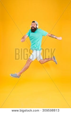 Bearded Guy Enjoy Music. Impetuous Movement. Hipster Dancing Jumping Headphones Gadget. Inspiring So