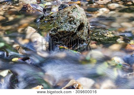 A Stony Streambed, A Stream Of Clear Water. Stream Repinka In The City Of Obninsk, Russia