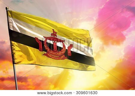 Fluttering Brunei Darussalam Flag On Beautiful Colorful Sunset Or Sunrise Background. Brunei Darussa