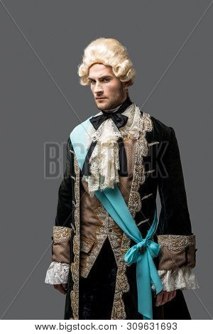 Pompous Victorian Gentleman In Wig Standing Isolated On Grey