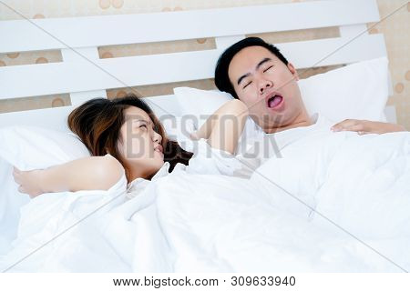 Snoring May Cause Apnea. May Cause Death. Asian Couple That The Wife Must Endure The Behavior Of Her