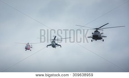 Military Helicopters Flying Towards The Action. Rescue, Assault And Cargo Helicopter.