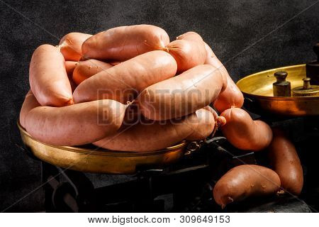 Big Group Of Short Thick Wieners Rolled In Spiral On Scales