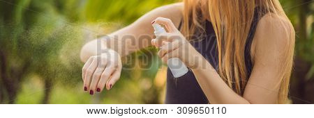Woman Spraying Insect Repellent On Skin Outdoor Banner, Long Format