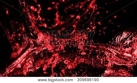 Abstract red wine splash shape on black background. Bavaragers and drink graphic element