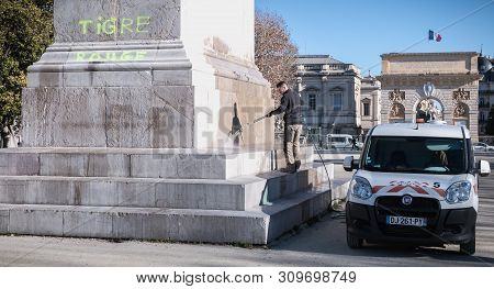 City Employee Who Cleans The Statue Of Louis Xiv In Montpellier, France