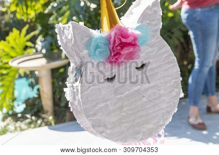 A Close Up View Of A Unicorn Pinata At A Kids Birthday Party Ready And Waiting