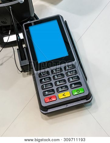 The Digital High Performance Pin Pad With Rich Multimedia And Commerce Capabilities On White Table