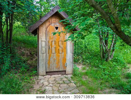 Wooden Shed Ecological Composting Toilet On Countryside Eco Farm - Concept Image