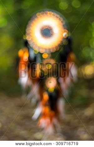 Blurred Image, Dream Catcher Native American In The Wind With Sunlight And Blurred Bokeh