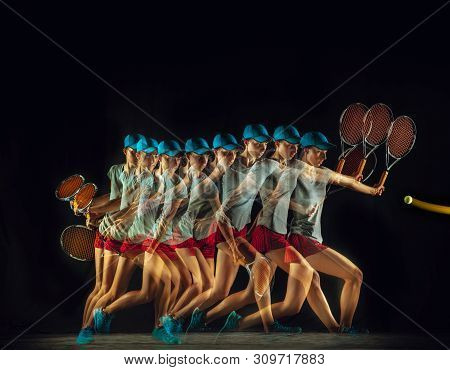 One Caucasian Woman Playing Tennis Isolated On Black Background In Mixed And Stobe Light. Fit Young 