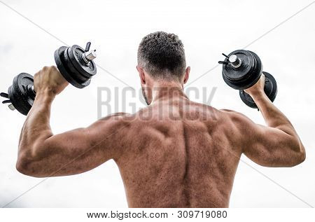 Man Sportsman Weightlifting. Steroids. Athletic Body. Dumbbell Gym. Fitness And Sport Equipment. Mus
