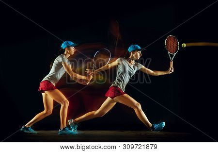 One Caucasian Woman Playing Tennis Isolated On Black Background In Mixed And Stobe Light. Fit Young 