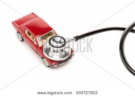 Kyiv, Ukraine - May 14, 2019: Red Toy Car And Stethscope Isolated On White Surface