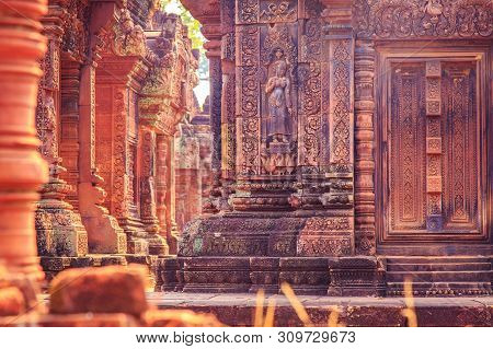 Celestial Maiden Carved Into The Red Sandstone Walls, Banteay Srei Temple, Angkor, Cambodia.