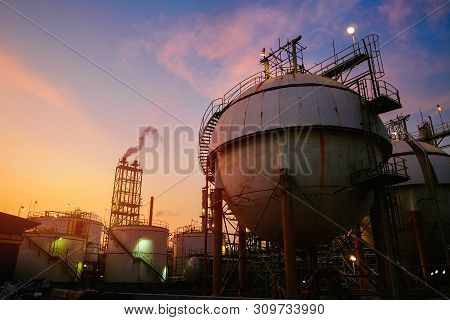Gas Storage Sphere Tanks In Petrochemical Industrial On Sunset Sky Background, Oil And Gas Refinery 