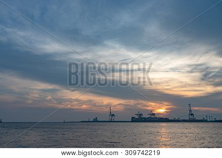 Osaka Bay With Yumeshima Island On Background In Summer Sun Set Time, View From Osaka Metro Cosmosqu
