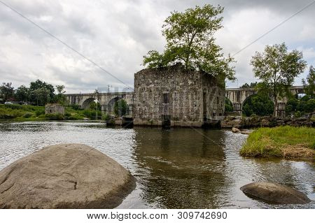 Amares, Portugal - June 20, 2019 : Ruins Of A Mill On The Green Banks Of The River Cávado In Braga, 