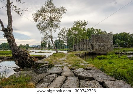 Amares, Portugal - June 20, 2019 : Ruins Of A Mill On The Green Banks Of The River Cávado In Braga, 