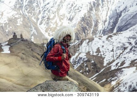 View At Young Hiker With Traditional Papakha Fur Hat At High Latitude Mountains At Mtskheta-mtianeti