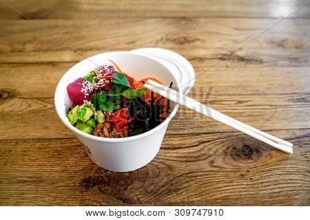 Raw Organic Ahi Tuna Poke Bowl With Rice And Veggies