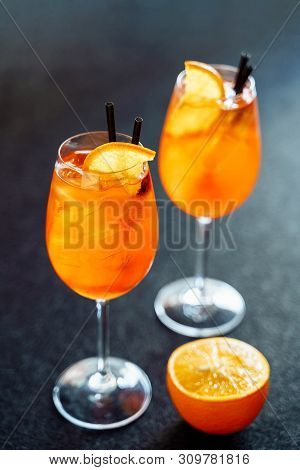 Aperol Spritz Sweet Cocktail Drink With Orange Ice. Bar Wine Aperitif Liqueur With Gin And Prosecco 