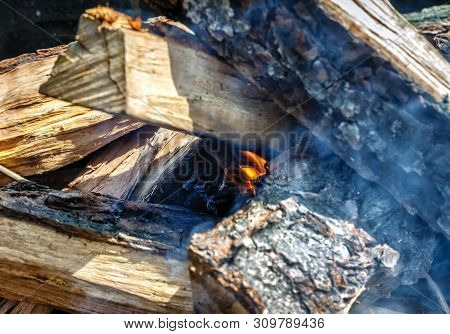 Only He Took Appeared The Fire Among The Wood-fire In The Grill.