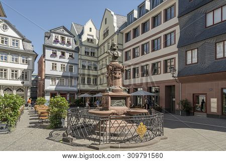 Frankfurt, Germany. July 2019.   The Friedrich-stoltze-brunnen Fountain In The Hühnermarkt Square In