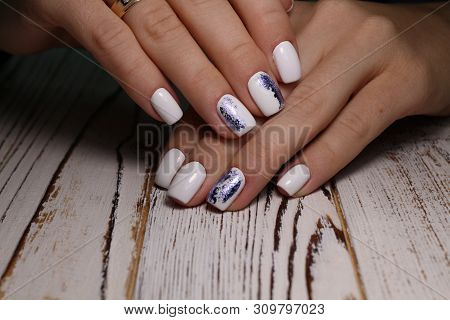 Multi-colored Pastel Manicure Combined Tone On Tone With A Striped Background.nail Art