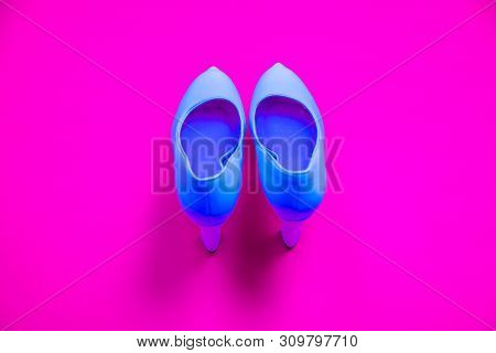 Blue High Heeled Shoes On Pink Purple Background - Top View - Heels Pointing Up