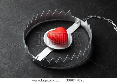 Trap With Heart. Love Is Like Bait. Black Background