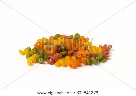 Multicolored Italian Pasta From Different Varieties Of Flour On A White Background