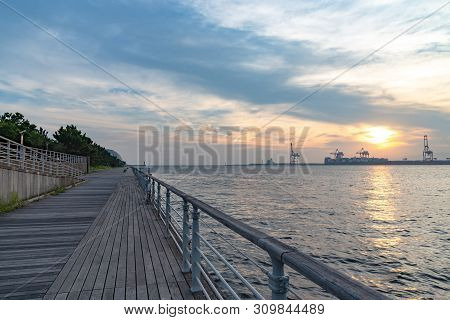 Osaka Bay With Yumeshima Island On Background In Summer Sun Set Time, View From Osaka Metro Cosmosqu