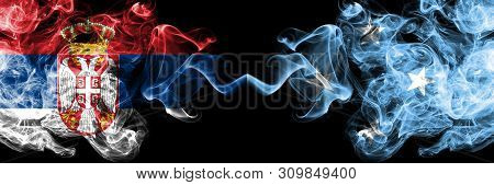 Serbia Vs Micronesia, Micronesian Smoky Mystic Flags Placed Side By Side. Thick Colored Silky Smokes