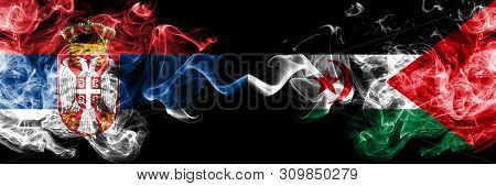 Serbia Vs Sahrawi Smoky Mystic Flags Placed Side By Side. Thick Colored Silky Smokes Combination Of 
