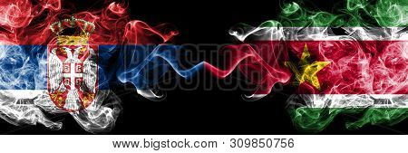 Serbia Vs Suriname, Surinamese Smoky Mystic Flags Placed Side By Side. Thick Colored Silky Smokes Co