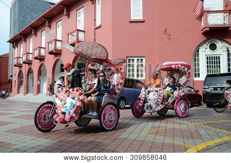 Melaka, Malaysia - 25 Jun, 2019: The Decorated Trishaw Carry Tourists To Tour Around In Dutch Square