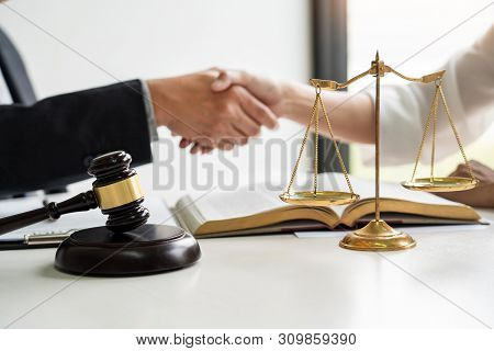 Handshake After Cooperation Between Attorneys Lawyer And Clients Discussing A Contract Agreement Hop
