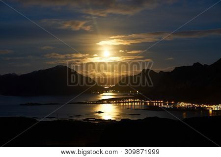 Lofoten Landscape During Night With The Rising Moon Near Fredvang.