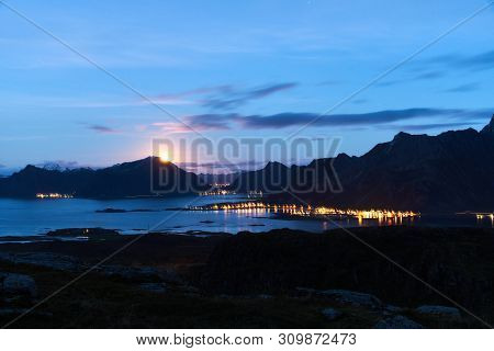 Lofoten Landscape During Night With The Rising Moon Near Fredvang.
